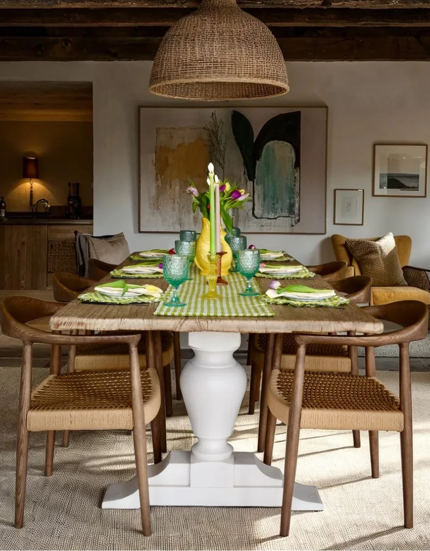 Dining room with a solid oak table laid for lunch